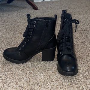 Black combat heeled tie up booties